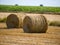 Yellow bales of hay on filed in summer