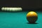 Yellow ball on billiard table