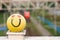 Yellow ball with painted smiling face and eyes with hearts