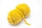 Yellow ball of wool yarn for knitting close up on a white background.