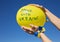 Yellow balloon with the inscription stand with Ukraine against the blue sky