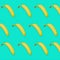 Yellow bananas pattern on turquoise colored background. Summer fruit conceptual image for covers, flyers.