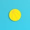Yellow basketball ball on bright blue background in pastel colors. Minimalism concept