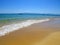 Yellow beach sand and beautiful blue sea. Natural living. Pelion peninsula. Pagasetic gulf. Platanias village. Greece.