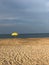 Yellow Beach Umbrella Against an Angry Sky