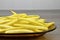 Yellow bean pods on the glass plate, detail