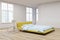 Yellow bed, wooden floor corner view