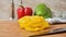 Yellow bell pepper being sliced and disappearing from the counter