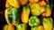 yellow bell peppers displayed for sale, a staple of any kitchen