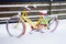 Yellow bike covered with snow