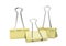 Yellow binder clips on white. Stationery item