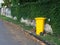 Yellow bins are placed on the side of the road in the village. Trash is for people in the village for left the garbage waiting to