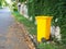 Yellow bins are placed on the side of the road in the village. Trash is for people in the village for left the garbage waiting to