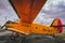 Yellow biplane from side standing on airports with cloud sky