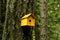 Yellow birdhouse