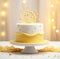 a yellow birthday cake with gold stars on top