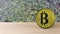 Yellow bitcoin gold coin Isolated on blur leaves background. bit-coin 3d render isolated, cryptocurrency, crypto, business,