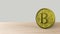 Yellow bitcoin gold coin Isolated on wood wooden table. bit-coin 3d render isolated, cryptocurrency, crypto, business, managment,