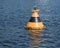 Yellow-black buoy in the water