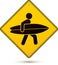 Yellow and black caution sign with surfer