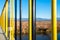 Yellow and black painted metal safety bars on a small concrete bridge over Olt river