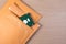 Yellow blank envelope with transparent bubble wrap or packaging shockproof on wooden table with storage hard disk.