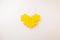 Yellow block heart on white background