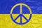 Yellow and blue flag with a crumpled texture with a peace sign on it