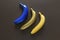 Yellow, blue and golden bananas collection isolated on black