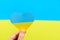 Yellow-blue heart in the color of the flag of Ukraine in the hand of a person, a place for text. Love for one& x27;s