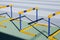 Yellow blue jumping hurdles on running track