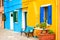 Yellow and blue painted facades of the houses in Burano, Italy