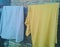 yellow and blue skirt hanging on clothesline