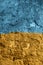 Yellow and blue Ukrainian flag on a peeling paint wall. Stop the war, help Ukraine