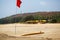 The yellow board of the rescuer for surfing lies on the sand used by the lifeguard working on the Arambol beach