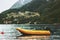 Yellow boat fjord and foggy Mountains Landscape