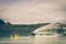 A Yellow Boat Glacier Cruise in Tasman Lake with Vintage Colour Effects