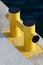 Yellow bollard pier - device for yacht mooring in marina