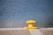 Yellow bollard on pier with sea view