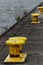 Yellow bollards on the quay