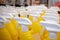 Yellow bottles in the store. Sprayers for water. Beautiful sprayers are on the supermarket shelves