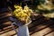 Yellow bouquet with flowers and green leaves