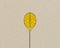 Yellow brain light bulb metaphor for idea with pencil on brown recycled background