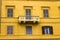 Yellow building with balcony