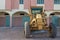 The yellow bulldozer park in front of colorful building