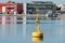 Yellow buoy closeup and blue water of the sea