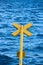 Yellow buoy on the sea waves background