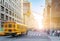 Yellow bus driving fast down Fifth Avenue in Manhattan New York City