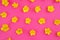Yellow buttercups on a pink background. Vivid image, copy space.