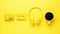 Yellow camera, headphones, cassette tape and a cup of coffee on a yellow background. Color trend